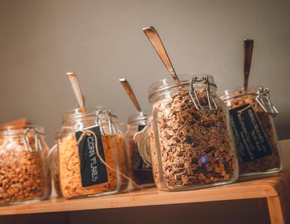 Close-up of various types of muesli in glass containers at the breakfast buffet at Hotel Villa Alberta.