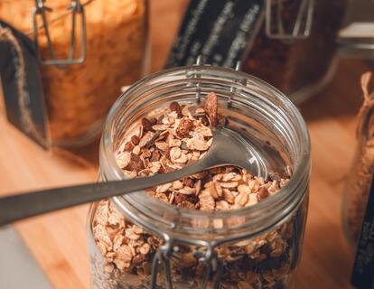 Close-up of various types of muesli in glass containers at the breakfast buffet at Hotel Villa Alberta.
